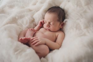 newborn baby photography curled up cream