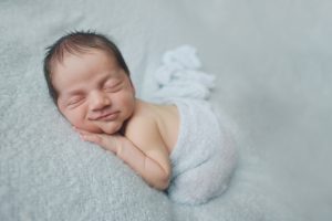 newborn baby photography smile blue wrap