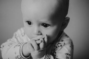 sitter baby photography black white