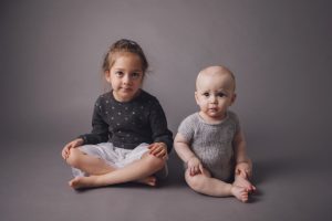 sibling baby photography black white