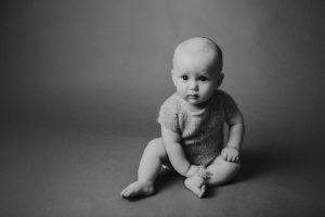 sitter baby photography black white