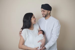 sibliing baby sikh girls boy newborn holding cream