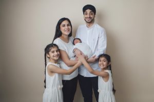 sibliing baby sikh girls boy newborn holding cream parents mum dad