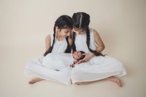 sibliing baby sikh girls boy newborn holding cream parents mum dad