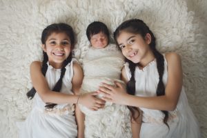 sibliing baby sikh girls boy newborn holding cream parents mum dad