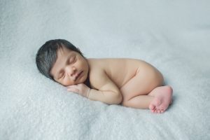 baby newborn photography blue boy curled up pose natural