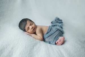 baby newborn photography blue boy curled up pose natural