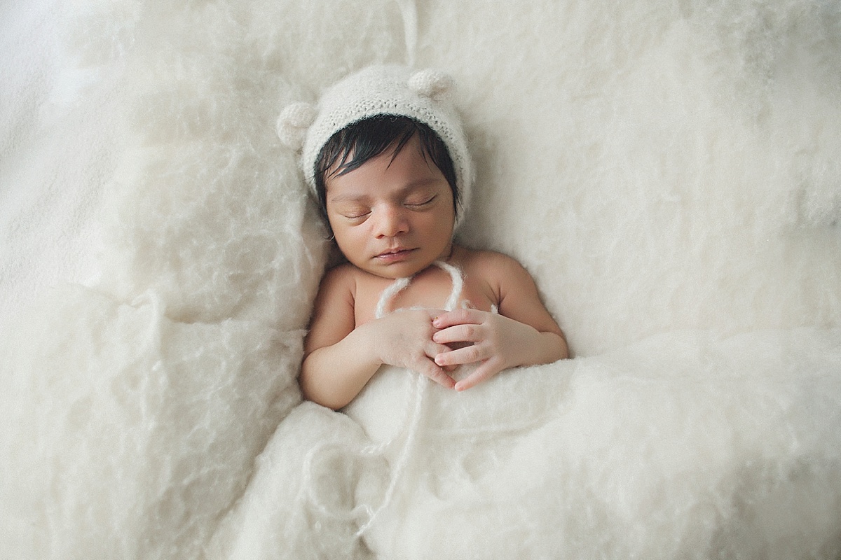 baby newborn photography cream bear hat boy curled up pose natural