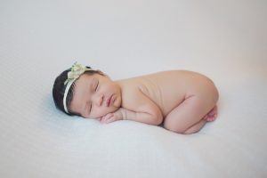 newborn baby photography upminster ivy nell headband posed curled up