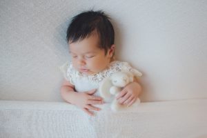 newborn baby photography upminster outfit lace cuddly bunny bed asleep