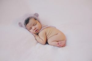 bear hat newborn baby photo curled up pose blush pink