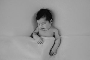 black and white bed newborn photography