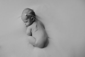 black white newborn baby photography curled posed pose