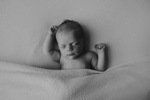 natural black white newborn baby photography curled posed pose