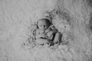 black white newborn baby photography curled posed pose