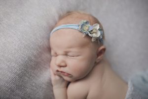 newborn baby girl with blue floral headband