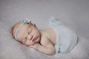 newborn baby girl with blue floral headband