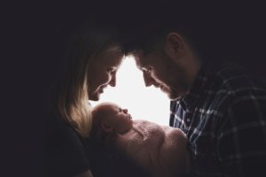 newborn baby girl hands parents backlit backlight silhouette